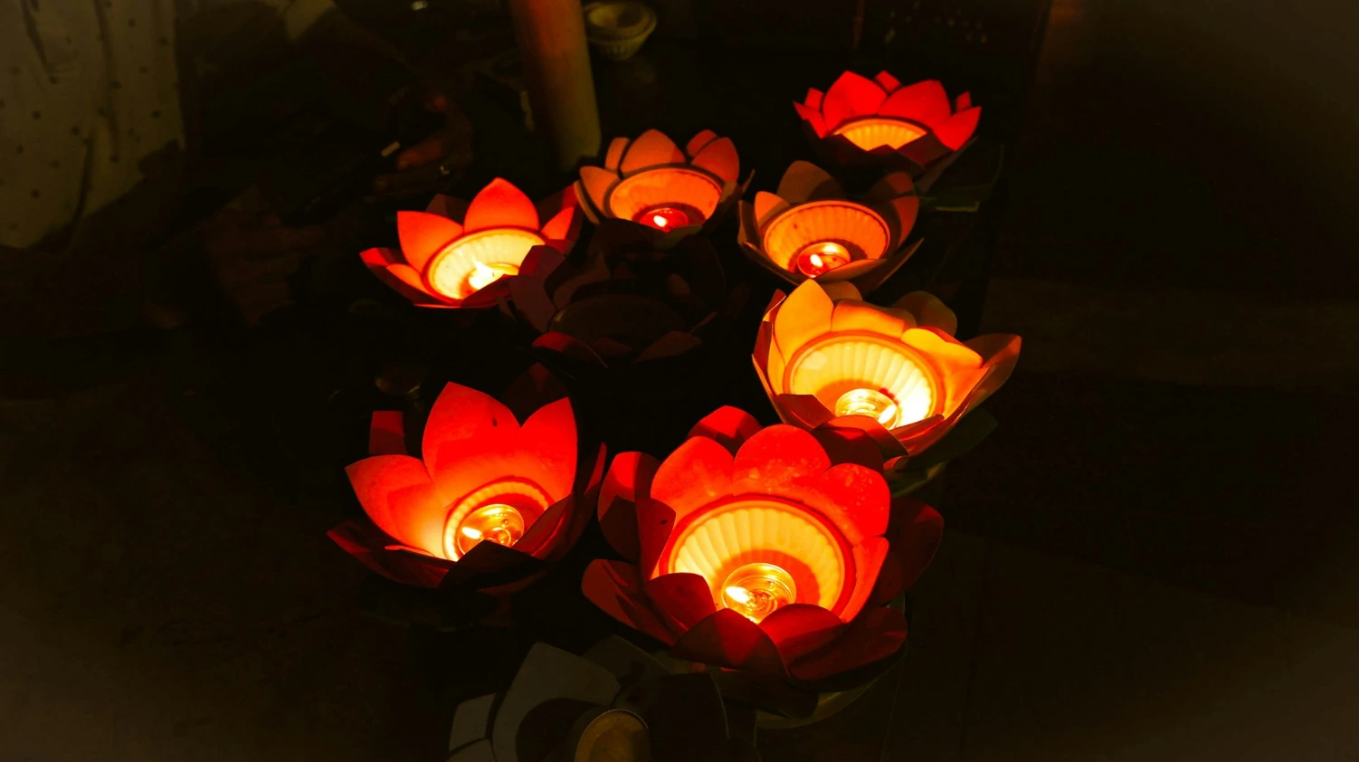 a group of lit candles sitting on top of a table